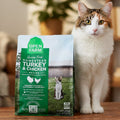 Green bag of Open Farm Homestead Turkey & Chicken recipe pet food on a beige background