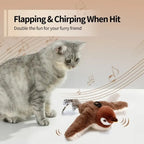 Cat playing with a toy that flaps and chirps when hit, on a light background.