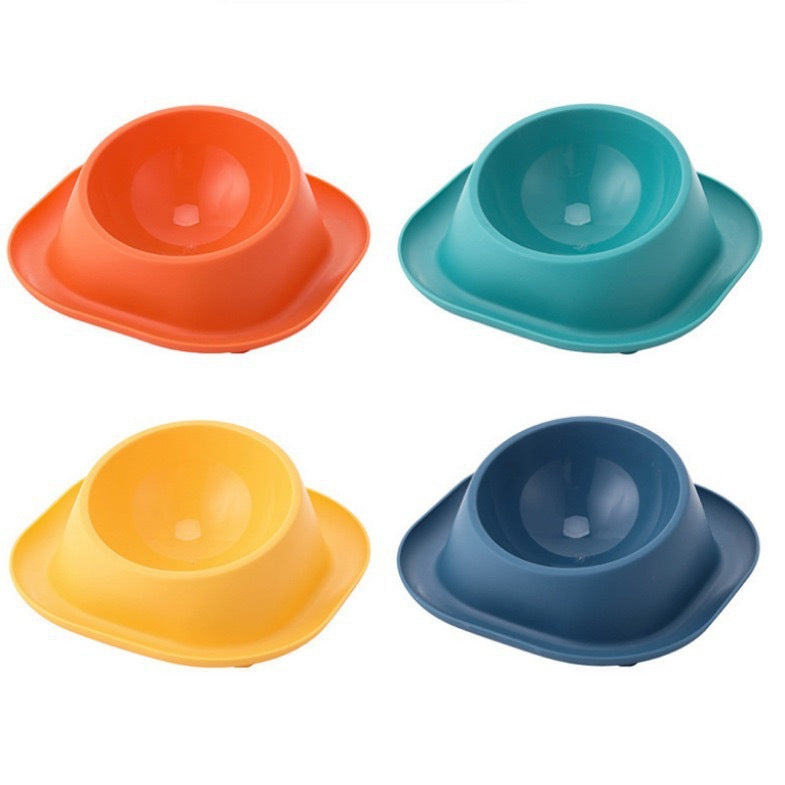 Four colorful pet bowls in orange, blue, yellow, and blue on a white background