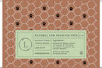 Label for natural paw balm for pets on a brown background with paw prints.