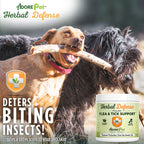 Dog chewing on a stick with  Pet Herbal Defense product in the foreground