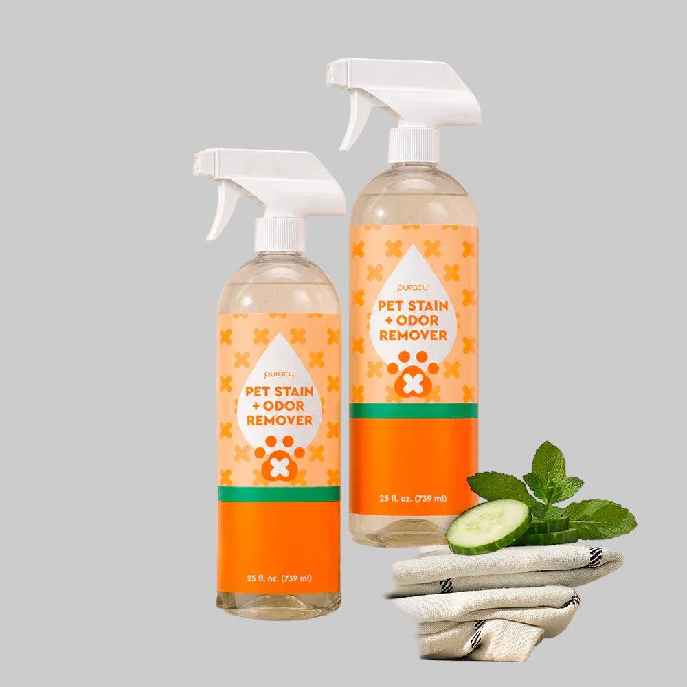 Two bottles of pet stain and odor remover on a tiled wall background
